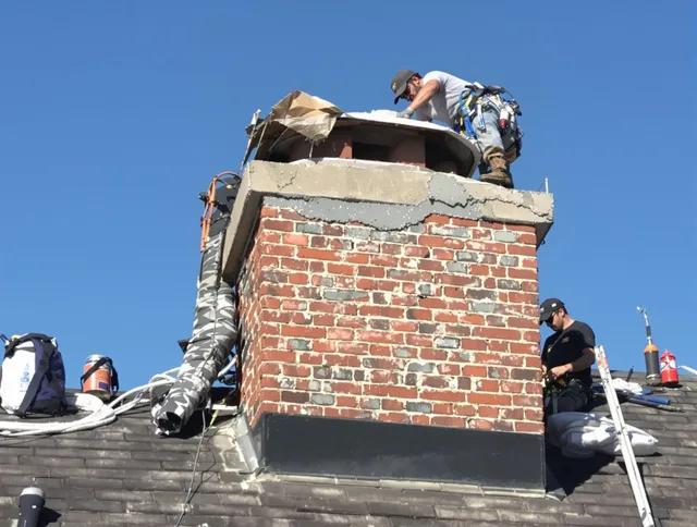 Greeley Chimney Sweep installing a custom chimney crown in Greeley, CO