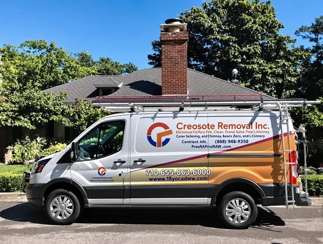 Greeley Chimney Sweep technician removing creosote safely in Greeley, CO