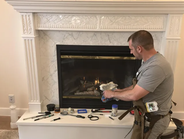 Greeley Chimney Sweep performing fireplace maintenance in Greeley, CO